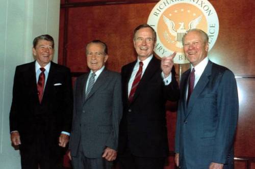 Ronald Reagan, left, Richard Nixon, and Gerald Ford, far right, pose with George Bush in the Richard Nixon Library and Birthplace in 1990. (AP Photo/Barry Thumma) (Credit: Associated Press)